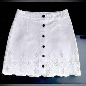 Eyelet embroidered white mini skirt